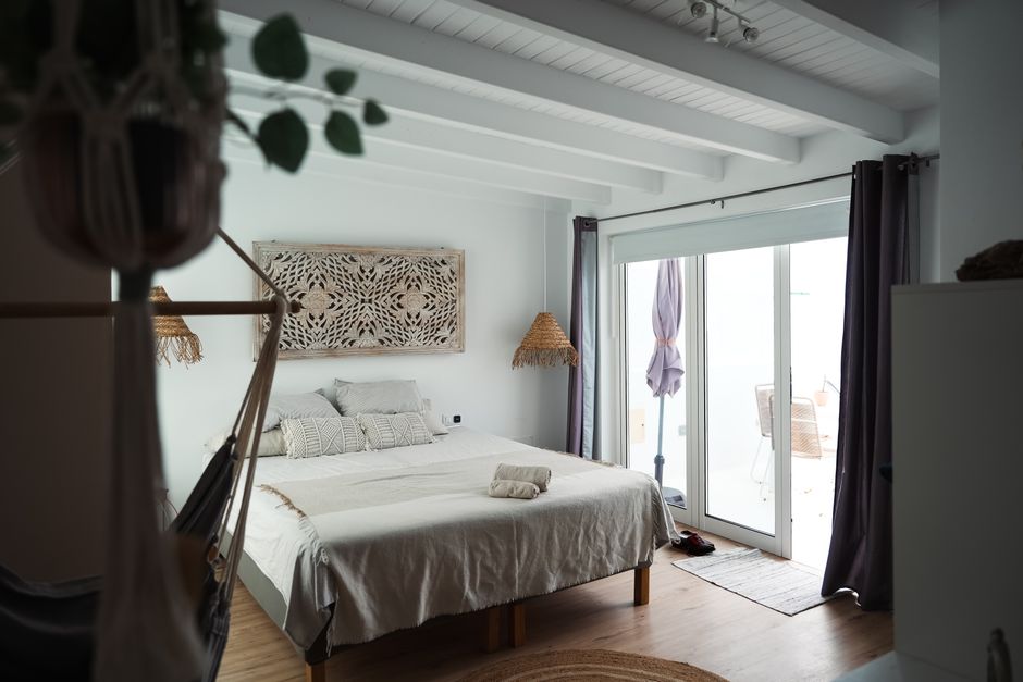 Cozy and stylish bedroom with bright natural light in Lanzarote, Spain.