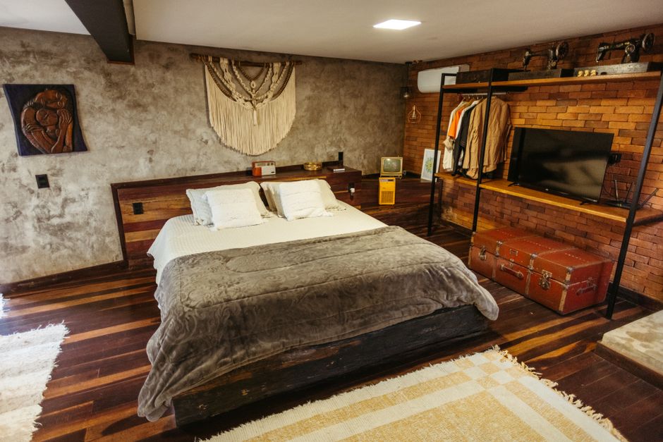 Inviting rustic-style bedroom with modern amenities in Santa Teresa, Brazil Airbnb.