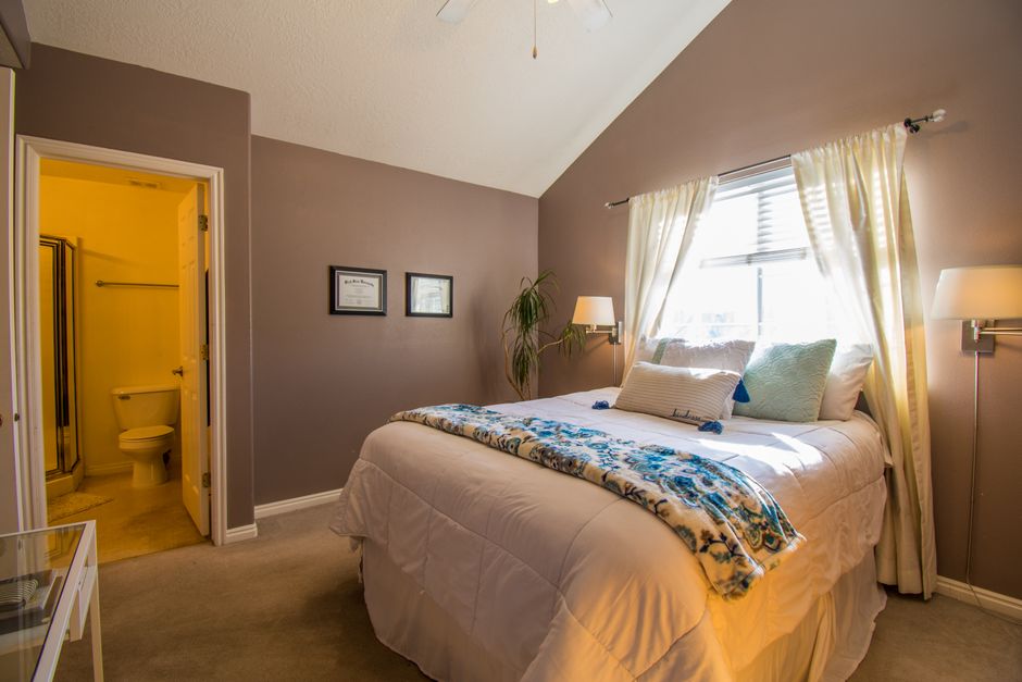 Bright and organized bedroom showcasing modern interior design with natural light.