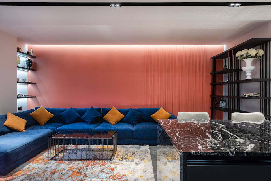 Contemporary living room interior with couch and table on rug with abstract ornament at home
