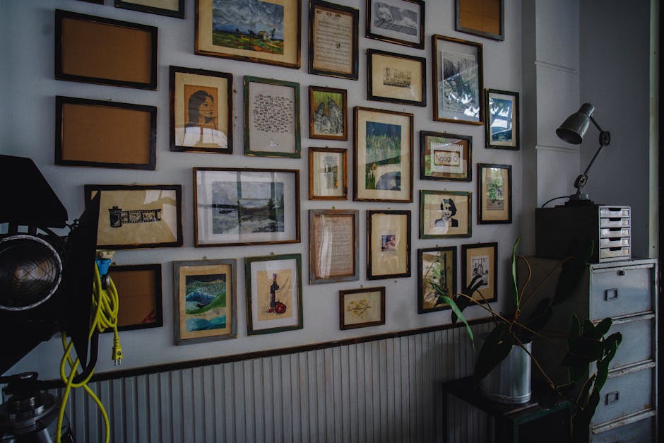 A cozy room with a collection of framed artwork and a modern industrial style.